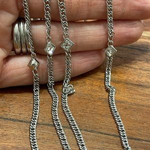 Beautiful Givenchy long necklace. Silver with white crystals.